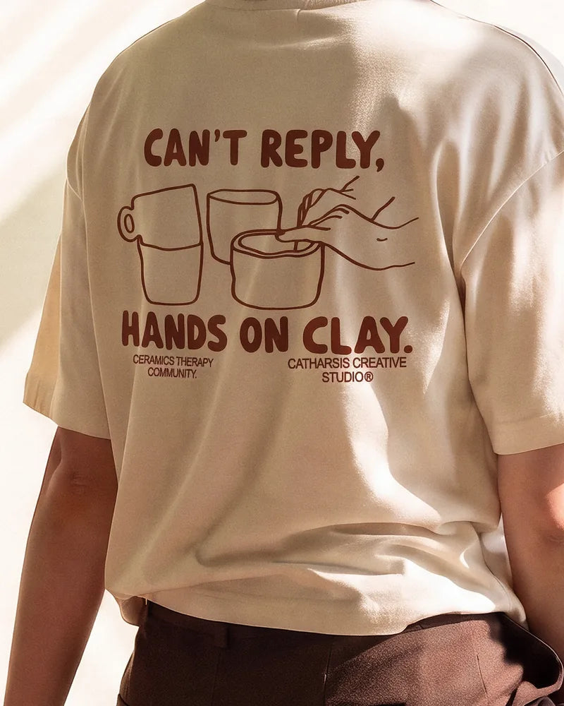 Close-up of the Can't Reply print on her back, in the sun. Image created or edited with AI.