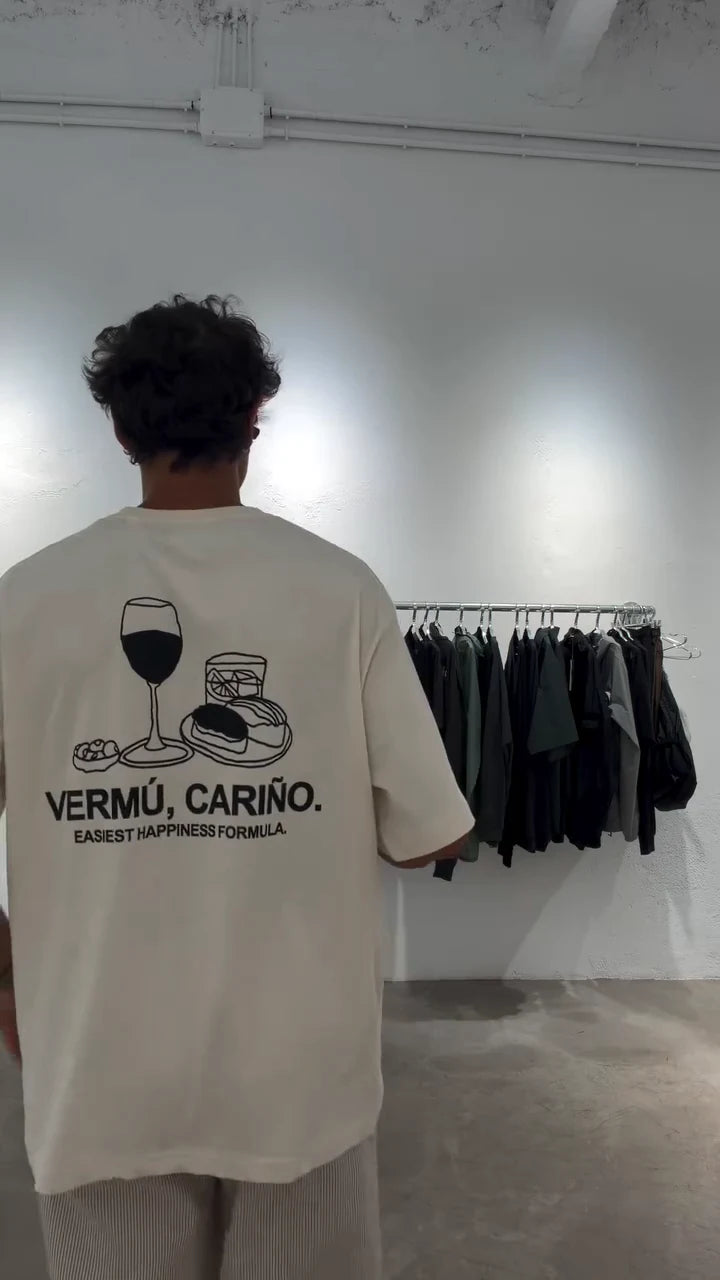 Front and back of the cream Vermú, Cariño T-shirt in store.