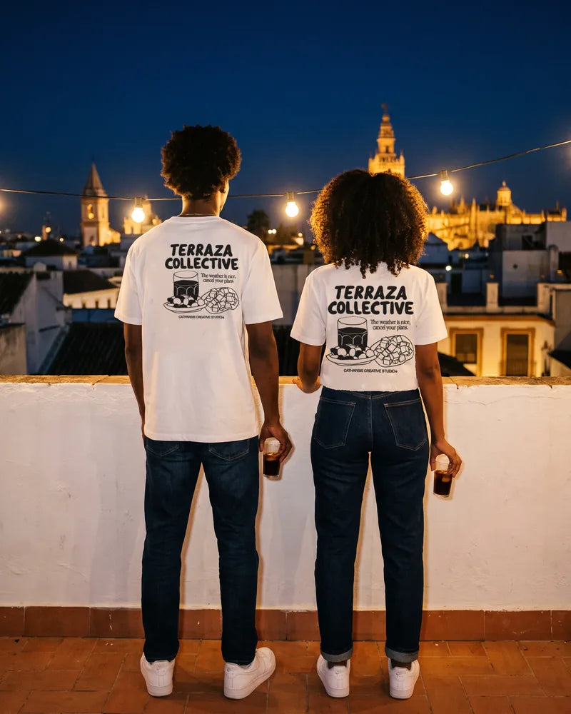Two friends wearing the Terraza Collective relaxed and cropped T-shirts on a rooftop in Seville at night, back view. AI-generated image.