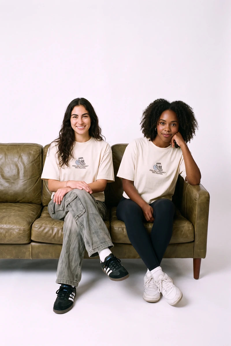 Try Pilates digital campaign: cropped T-shirt, front view, in the sofa scene. Image created or edited with AI.